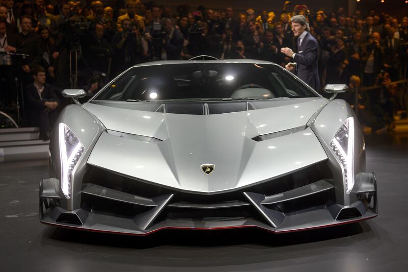 The new Lamborghini Veneno is introcuded by CEO and Chairman Stephan Winkelmann during a preview of Volkswagen Group (VW) on March 4, 2013 ahead of the Geneva Car Show in Geneva. AFP PHOTO / FABRICE COFFRINI
 *** Local Caption ***  620281-01-08.jpg