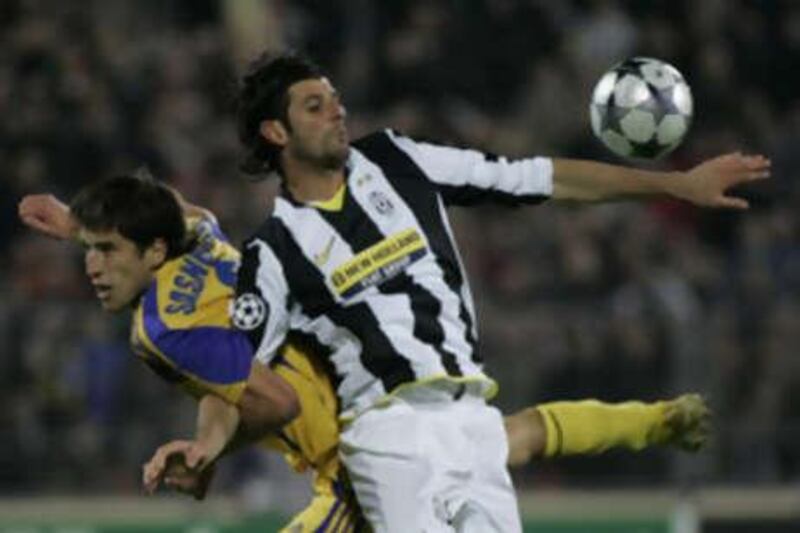 Juventus player Vincenzo Iaquinta, right, vies for the ball with BATE Borisov's Sergei Sosnovski.