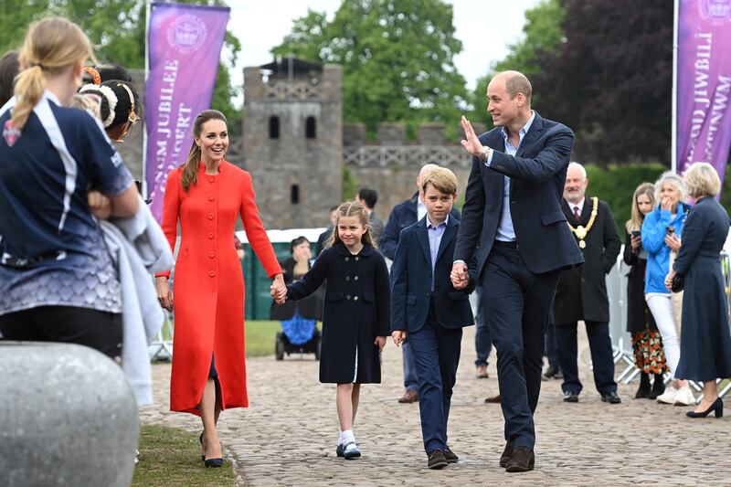 The Duchess of Cambridge wears a red coat by Eponine London to visit Cardiff castle in Wales with Prince William, Prince George and Princess Charlotte on June 4. Reuters 