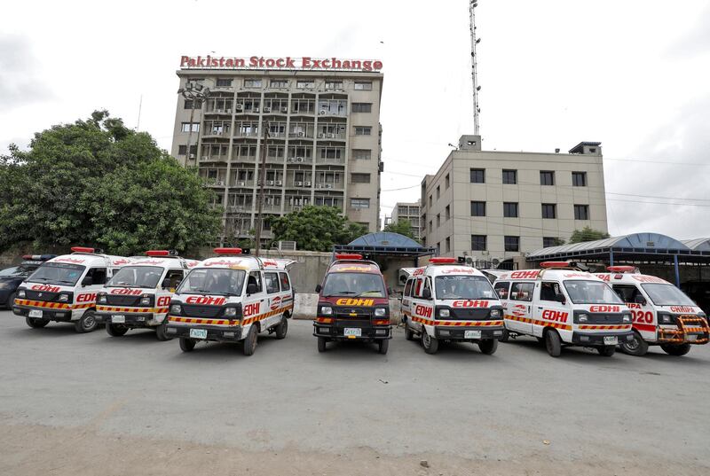 Ambulances are seen parked outside Pakistan Stock Exchange building after an attack in Karachi. REUTERS