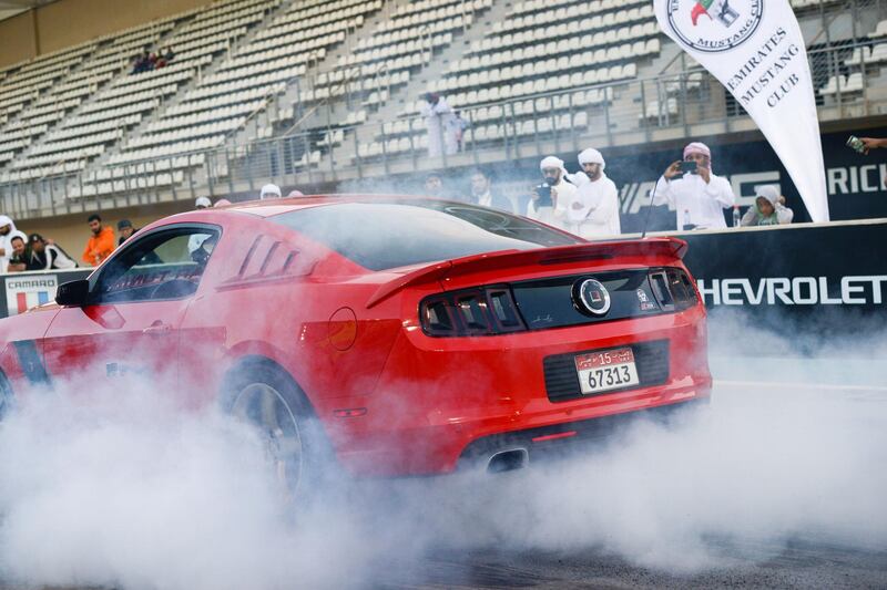 Abu Dhabi, United Arab Emirates - Mustangs burn out at the Drag Race Car Show event sponsored by Premium Motors & organized by Emirates Mustang Club at Yas Marina Circuit on January 29, 2018. (Khushnum Bhandari/ The National)
