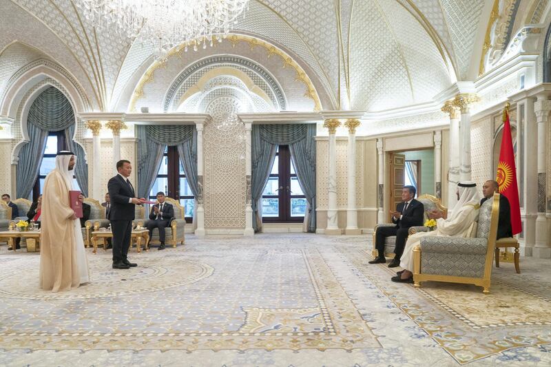 ABU DHABI, UNITED ARAB EMIRATES -December 12, 2019: HH Sheikh Mohamed bin Zayed Al Nahyan, Crown Prince of Abu Dhabi and Deputy Supreme Commander of the UAE Armed Forces (R) and HE Sooronbay Sharipovich Jeenbekov, President of Kyrgyzstan (3rd R), witness an MOU exchange ceremony,  during an official visit at Qasr Al Watan. Seen exchanging HE Sultan bin Saeed Al Badi, UAE Minister of Justice (L) and HE Otkurbek Dzhamshitov, The Prosecutor General of Kyrgyzstan (2nd L).

( Rashed Al Mansoori / Ministry of Presidential Affairs )
---