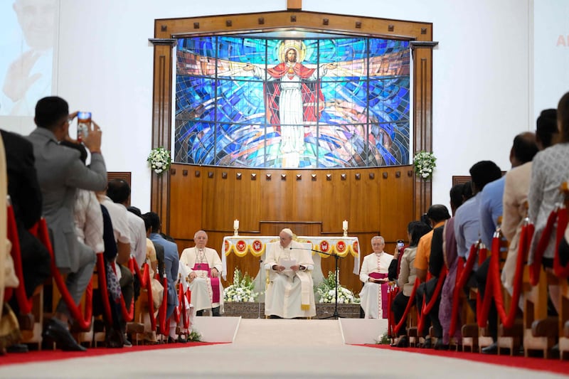 This handout photo released by the Vatican Media shows Pope Francis attending a prayer meeting at the Sacred Heart Church in the Bahraini capital Manama. AFP