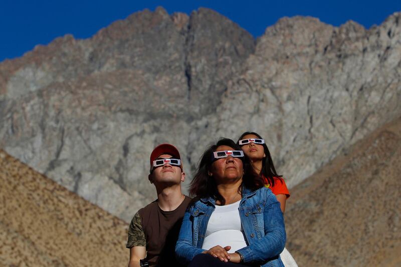 Chileans watch the sky prior to the total solar eclipse in Paiguano, Chile. Getty Images