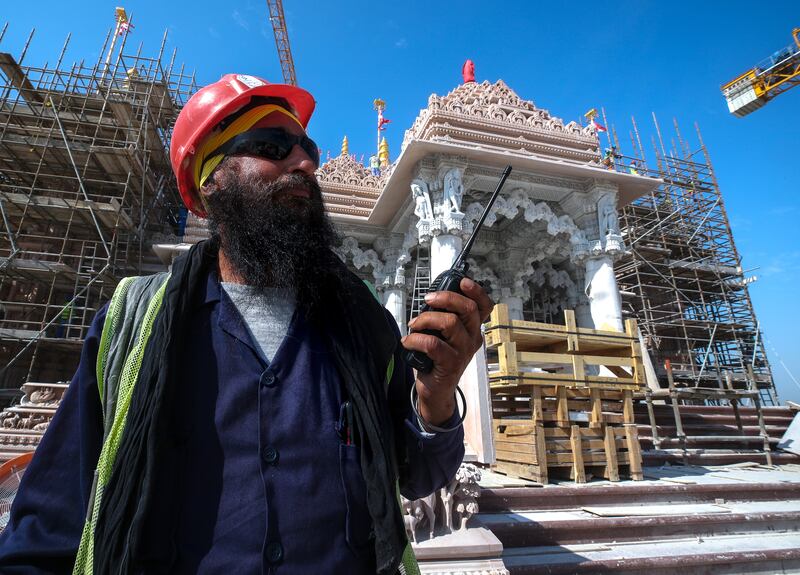 Construction is being completed at a rapid pace to deliver the UAE’s first traditional hand-carved Hindu temple. Victor Besa / The National