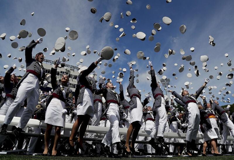 Cadets toss their caps after graduating from the United States Military Academy in West Point, New York. Julie Jacobson / AP Photo