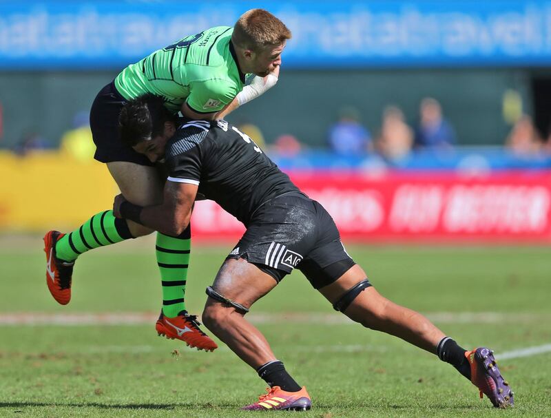 Scotland's Kyle Steyn, left, is tackled by Masirewa in a quarterfinal match. AP Photo