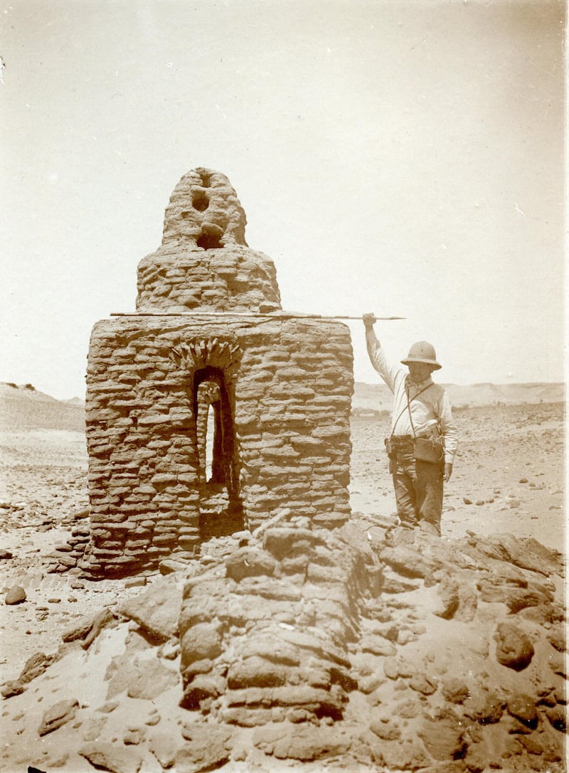 Ludwig Borchardt with a ranging pole as a benchmark next to a dome grave on the Gebel Adde.