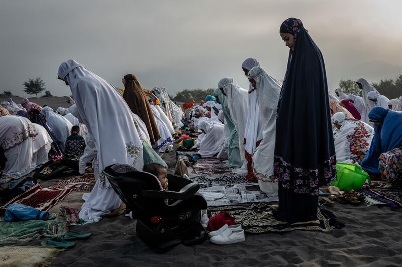 Muslims perform Eid Al Fitr prayer at Parangkusumo beach in Yogyakarta, Indonesia.