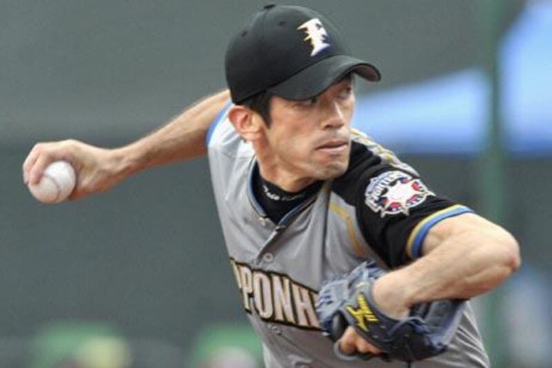 In this July 4, 2010 photo, Nippon Ham Fighters' Yoshinori Tateyama  prepares to throw the ball against the Rakuten Golden Eagles in a baseball game in Sendai, northern Japan. Japanese free-agent pitcher Tateyama has agreed to a one-year contract with the AL champion Texas Rangers that includes club options for each of the two seasons after that. (AP Photo/Kyodo News) JAPAN OUT, MANDATORY CREDIT, FOR COMMERCIAL USE ONLY IN NORTH AMERICA