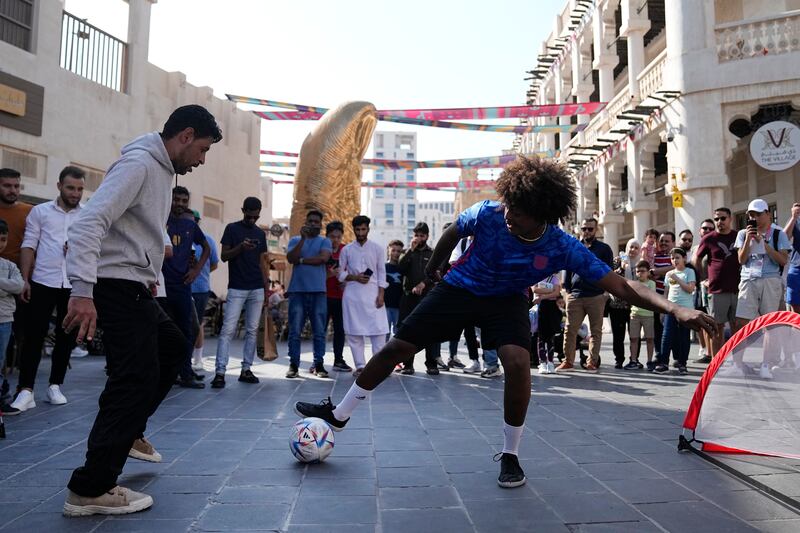 A kickabout at Souq Waqif in Doha. AP