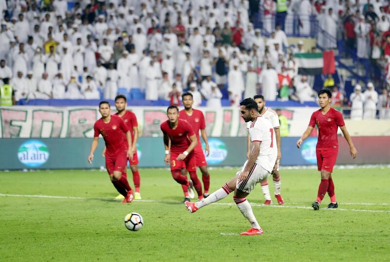Dubai, United Arab Emirates - October 10, 2019: UAE's Ali Mabkhout scores his second from the penalty spot during the Qatar 2022 world cup qualifier between The UAE and Indonesia. Thursday 10th of October. Al Maktoum Stadium, Dubai. Chris Whiteoak / The National