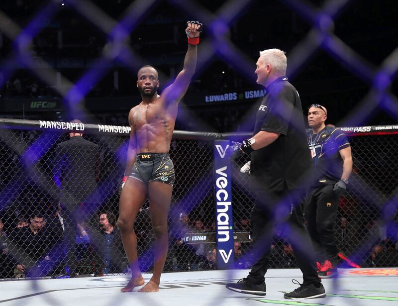 Leon Edwards celebrates after the welterweight title bout against Kamaru Usman at UFC 286. PA