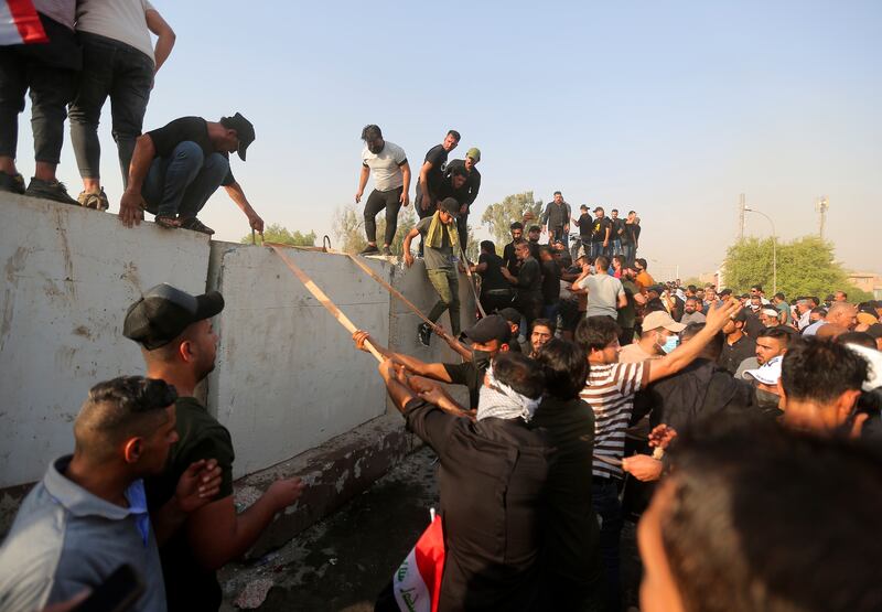 Co-ordination Framework supporters attempt to storm government areas in the Green Zone in Baghdad. AP