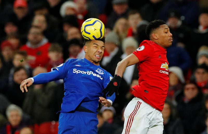 Everton's Mason Holgate in action with Manchester United's Anthony Martial. Reuters