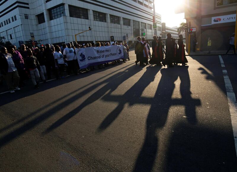 Church leaders carry a cross during a silent march celebrating Good Friday in Durban, South Africa, April 19, 2019. REUTERS/Rogan Ward