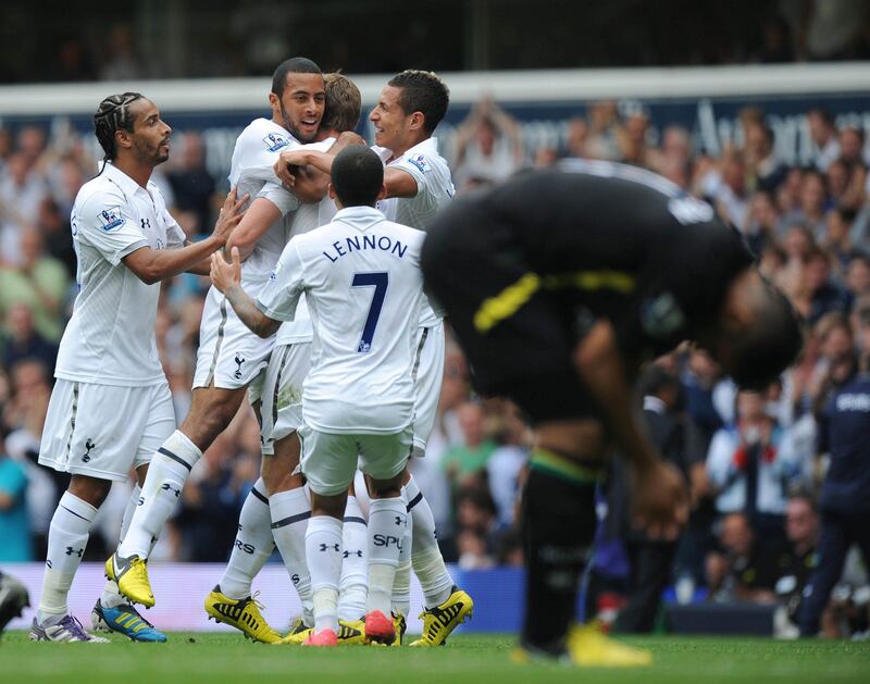 Tottenham Hotspur players celebrate with Belgian midfielder Mousa Dembele (2nd L) after his debut goal during the English Premier League football match between Tottenham Hotspur and Norwich City at White Hart Lane in north London, England on September 1, 2012. AFP PHOTO/OLLY GREENWOOD

RESTRICTED TO EDITORIAL USE. No use with unauthorized audio, video, data, fixture lists, club/league logos or “live” services. Online in-match use limited to 45 images, no video emulation. No use in betting, games or single club/league/player publications
 *** Local Caption ***  358535-01-08.jpg