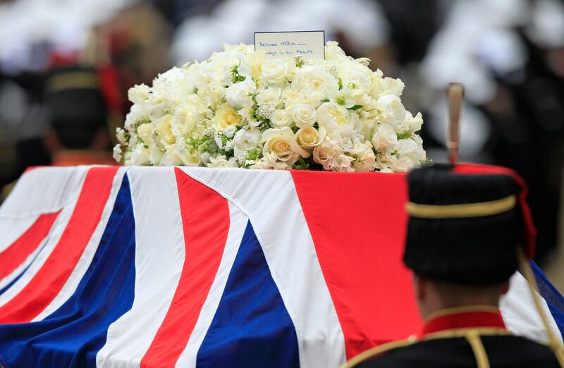 A Union flag draped coffin bearing the body of former British Prime Minister Margaret Thatcher is carried on a gun carriage drawn by the King's Troop Royal Artillery during her ceremonial funeral procession in London, Wednesday, April 17, 2013. The Iron Lady is being laid to rest - yet even in death, she remains a divisive figure. World leaders and dignitaries from 170 countries are to attend the funeral of former British Prime Minister Margaret Thatcher on Wednesday, an elaborate affair with full military honors that will culminate with a service at St. Paul's Cathedral in London. (AP Photo/Matt Dunham, Pool) *** Local Caption ***  Britain Thatcher Funeral.JPEG-09202.jpg