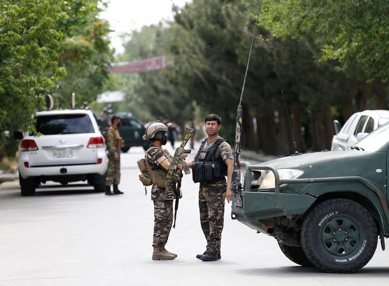 Afghan security forces stand guard near the site of an attack in Kabul, Afghanistan June 12, 2020.REUTERS/Mohammad Ismail