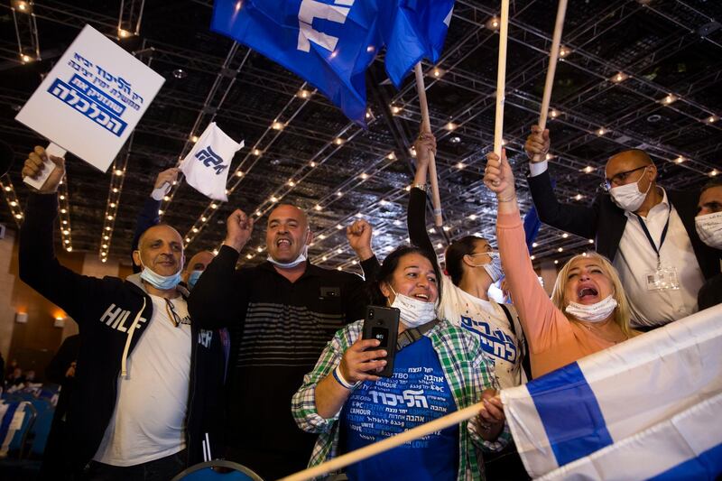 Likud party supporters cheer after the exit polls in Jerusalem. Getty Images
