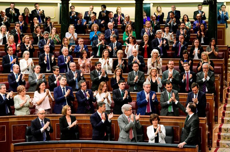 Spanish prime minister Mariano Rajoy, bottom right, acknowledges applause from Popular Party's members of parliament during a debate on a no-confidence motion at the Lower House of the Spanish Parliament in Madrid.  He was ousted by a no-confidence vote in parliament. Pierre-Philippe Marcou / AFP Photo
