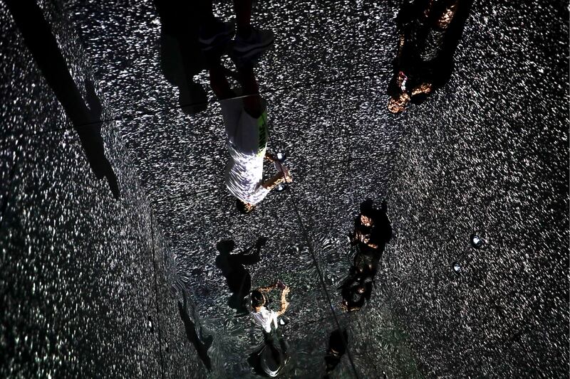 Visitors take a souvenir photo as they visit to an art installation titled Infinity Room displayed at The Future of Today Exhibition at Today Art Museum in Beijing. Andy Wong / AP photo