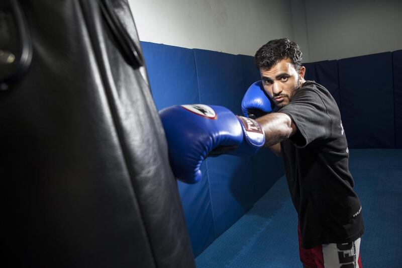 Kamran Khan of Pakistan has risen from working at the ports of Dubai to being a full-time trainer and successful kick boxer. Antonie Robertson / The National