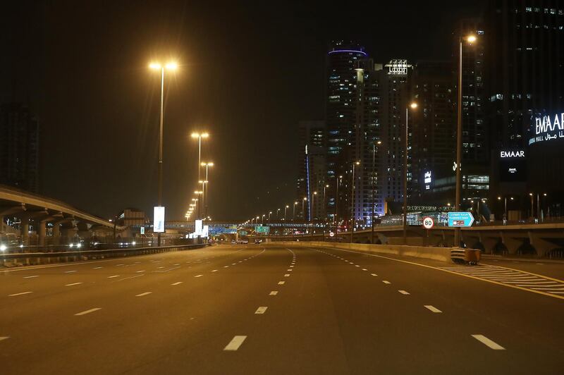 DUBAI, UNITED ARAB EMIRATES , April 05 – 2020 :- View of the almost empty Sheikh Zayed road in Dubai. Dubai is conducting 24 hours sterilisation programme across all areas and communities in the Emirate and told residents to stay at home. UAE government told residents to wear face mask and gloves all the times outside the home. Dubai Metro and Tram shut down until further notice. (Pawan Singh / The National) For News/Online/Instagram.