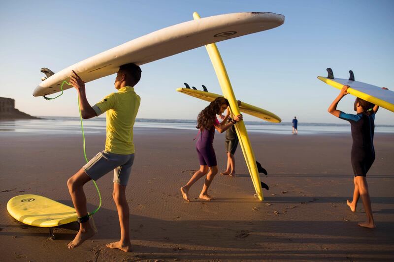 Students warm up during a surfing lesson in Tarfaya, Morocco. Reuters