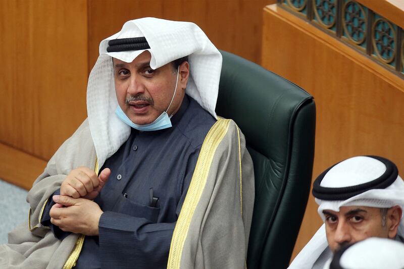 Sheikh Hamad Jaber Al Sabah (L) attends a parliamentary session at the National Assembly headquarters in Kuwait City. AFP