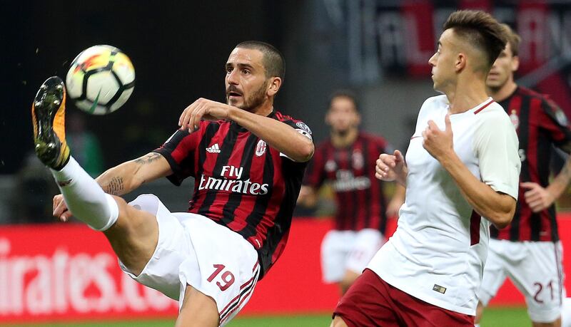 AC Milan's Leonardo Bonucci, left, and Roma's Stephan El Shaarawy go for the ball during the Serie A soccer match between AC Milan and Roma, at the Milan San Siro stadium, Italy, Sunday, Oct. 1, 2017. (Matteo Bazzi/ANSA via AP)