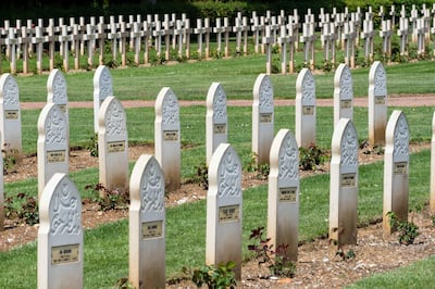 Muslim headstones from the First World War in Notre Dame de Lorette French national cemetery. In the background are Christian headstones. David Crossland / The National