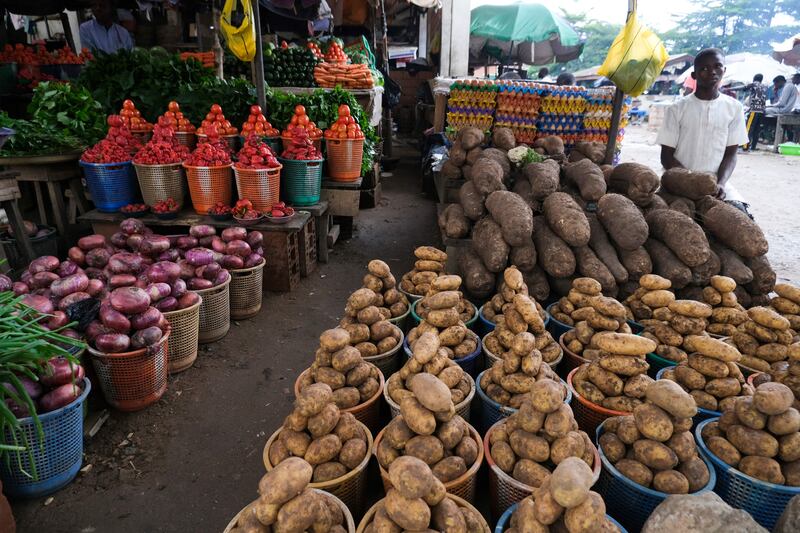 A trader displays farm produce at Wuse Market, Abuja, Nigeria. The country is in talks with the World Bank’s private lending arm and other lenders to raise about $30 million to help finance a vaccine plant. Kola Sulaimon  /  AFP
