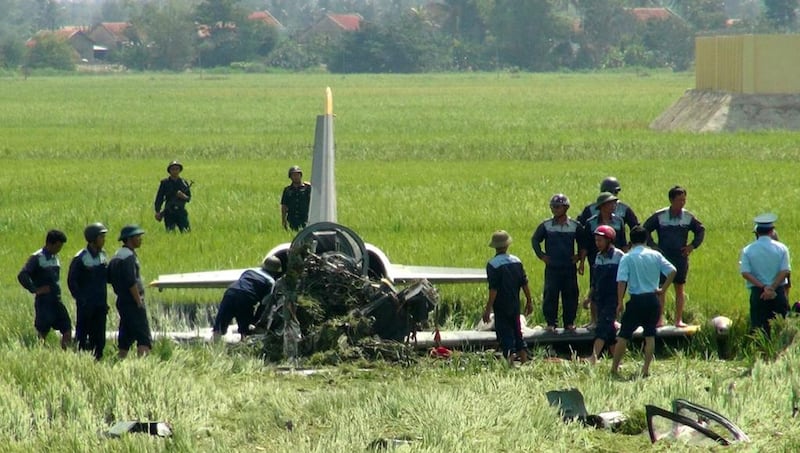 Emergency workers at the scene after a Vietnamese military jet fighter crashed into a rice field in Tuy Hoa, Phu Yen, Vietnam. EPA