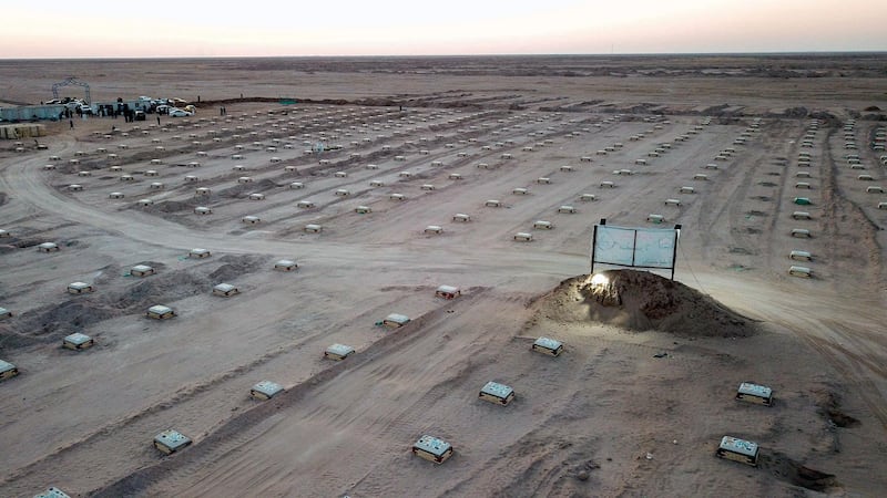 An aerial picture taken with a drone shows graves of victims who died with coronavirus at a cemetery in the city of Najaf, southern Iraq.  EPA