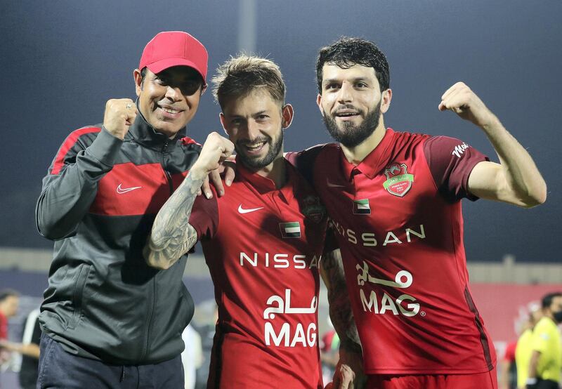 Sharjah, United Arab Emirates - Reporter: John McAuley. Sport. Shabab Al Ahli celebrate winning the match by penalties. Head coach Mahdi Ali (L) with Federico Cartabia (M) and Jaloliddin Masharipov. Shabab Al Ahli v Al Nasr in the Arabian Gulf Cup Final. Friday, April 9th, 2021. Sharjah. Chris Whiteoak / The National