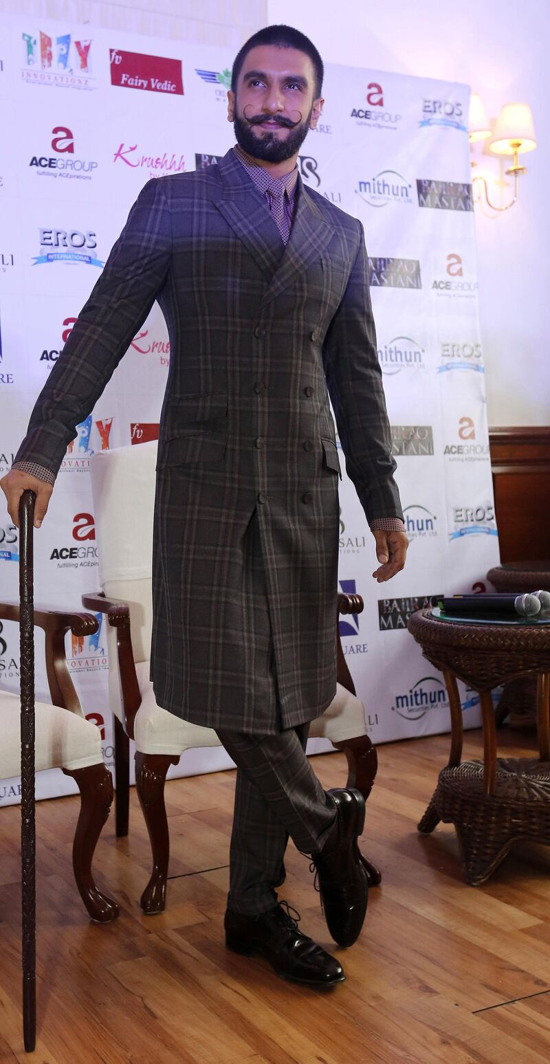 epa05065855 Indian Bollywood actor Ranveer Singh poses for pictures before a press conference for his role in the new Bollywood movie 'Bajirao Mastani' in New Delhi, India, 12 December 2015. Ranveer Singh and Deepika Padukone arrived in Delhi to promote their movie which is expected to release on 18 December.  EPA/RAJAT GUPTA
