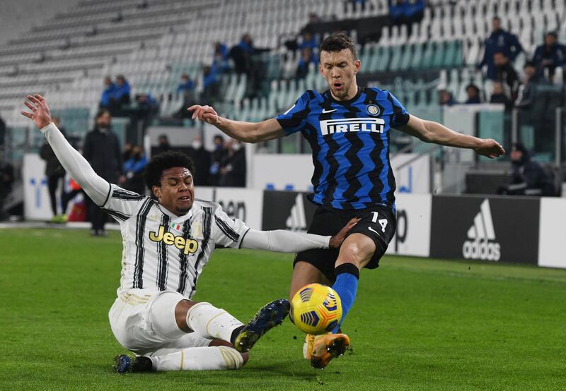 Weston McKennie of Juventus slides in to tackle Inter's Ivan Perisic. Getty