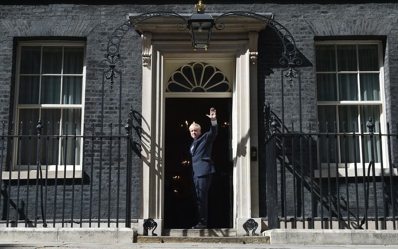 Mr Johnson waves from the door of 10 Downing Street on July 24, 2019