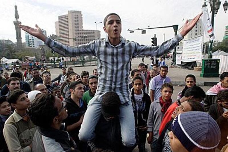 gyptians demand the military relinquishes its power in a protest in Cairo yesterday.