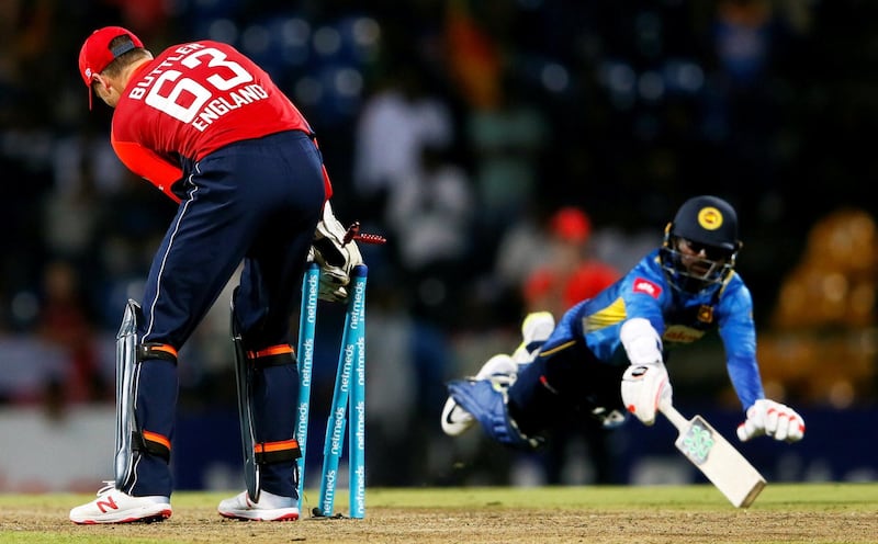 Sri Lanka's Akila Dananjaya is run out by England's Jos Buttler in the third one-day cricket international. Reuters