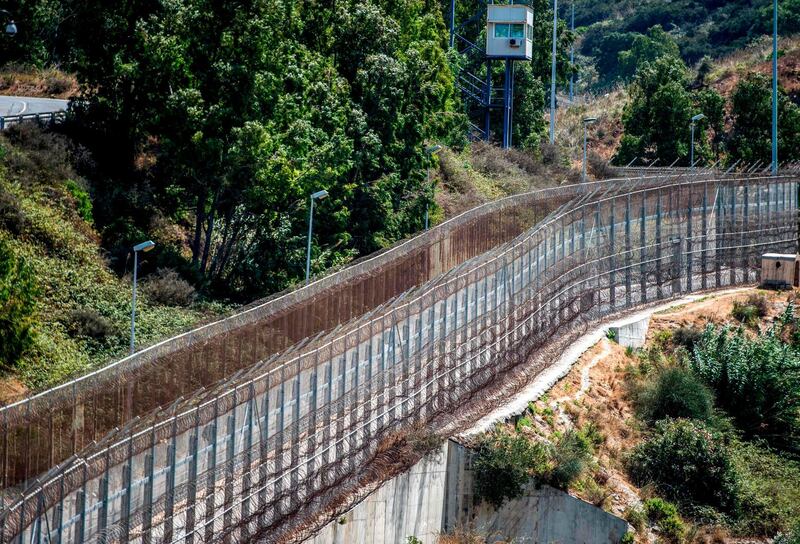 A picture taken on September 4, 2018 shows a view of a guard tower overlooking the border fence encircling Spain's North African enclave of Ceuta which lies on the Strait of Gibraltar, surrounded by Morocco. (Photo by FADEL SENNA / AFP)