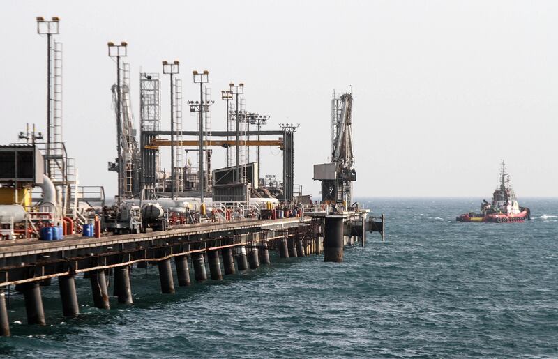 A picture shows an oil facility in the Khark Island, on the shore of the Gulf, on February 23, 2016. 
Iran's Oil Minister Bijan Namdar Zanganeh dismissed an output freeze deal between the world's top two producers Saudi Arabia and Russia as "a joke", the ISNA news agency reported.
 / AFP PHOTO / STR