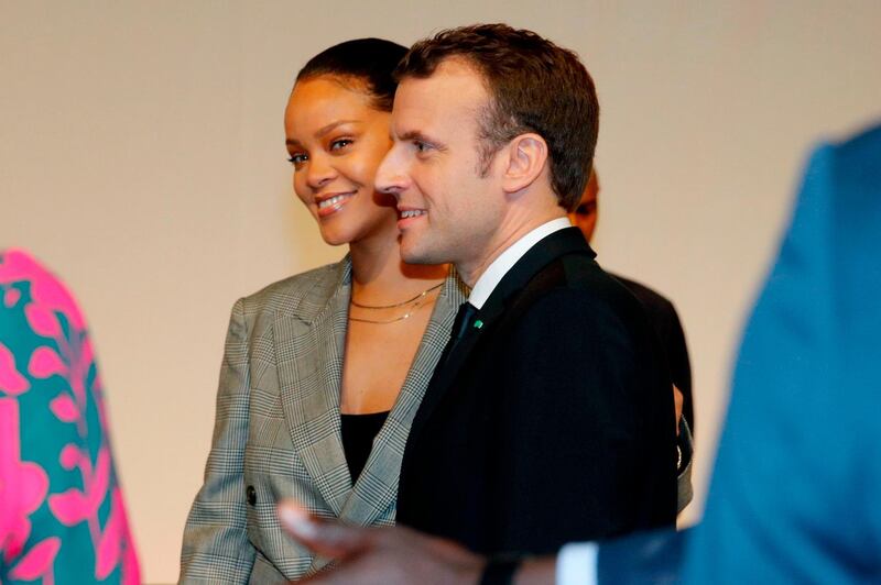 TOPSHOT - French President Emmanuel Macron and Barbadian singer Rihanna attend the conference "GPE Financing Conference, an Investment in the Future" organised by the Global Partnership for Education in Dakar on February 2, 2018, as part of Macron's visit to Senegal.
The French and Senegalese presidents are co-hosting a conference organised by the Global Partnership for Education, aimed at pressuring donors to finance the education of a quarter of a billion children worldwide who are currently out of school, while Rihanna is attending as a global ambassador for the organisation. / AFP PHOTO / POOL / PHILIPPE WOJAZER