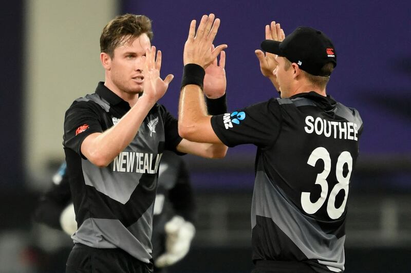 New Zealand's Adam Milne  celebrates with Tim Southee after taking the wicket of India's Rishabh Pan. AFP