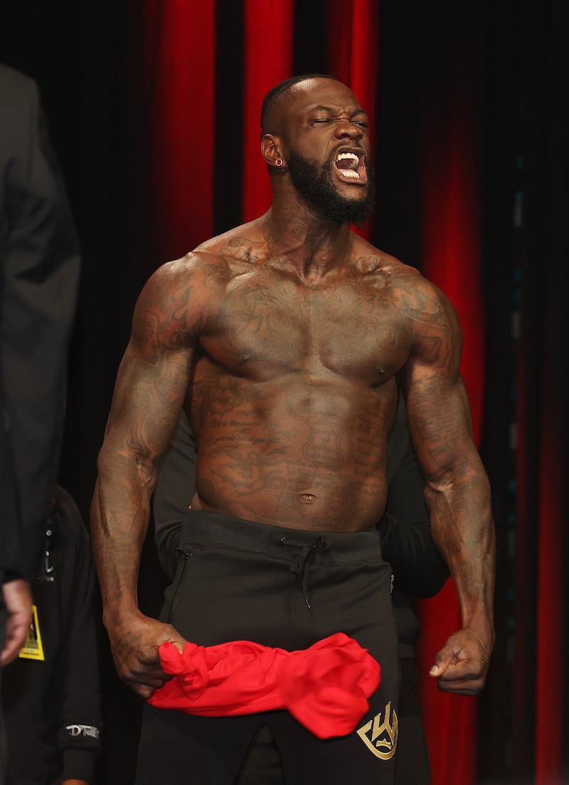 Deontay Wilder screams during his official weigh-in. AFP