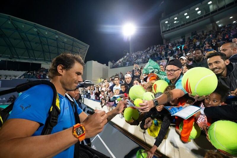 Rafael Nadal signs autographs for fans during the 2018 Mubadala World Tennis Championship in Abu Dhabi. Courtesy Flash Entertainment