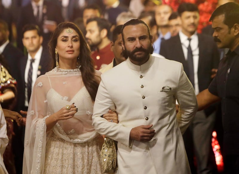 Bollywood actors Kareena Kapoor and Saif Ali Khan arrive to attend the wedding. AP Photo