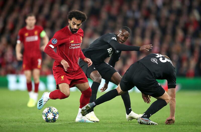 Salah and Red Bull Salzburg's Rasmus Nissen Kristensen, right, battle for the ball. PA Wire