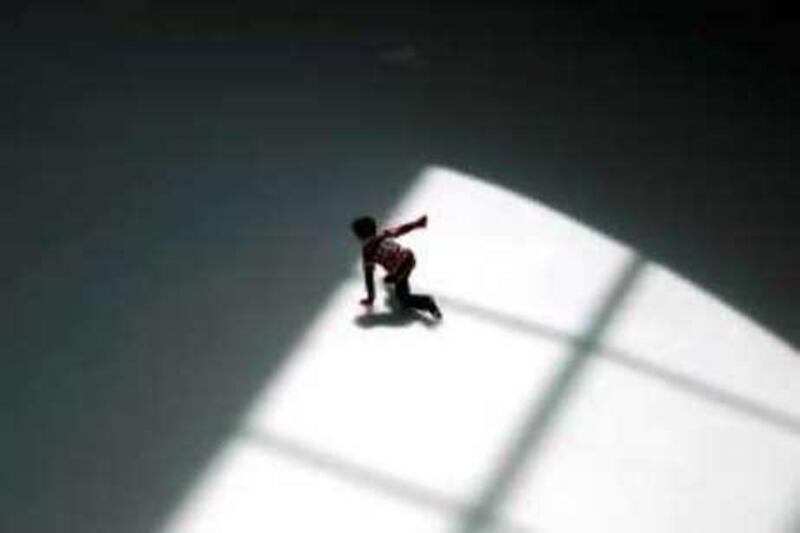 AL AIN, UNITED ARAB EMIRATES - March 25 2008: A child skates on the indoor ice rink at Al Ain mall. (Photo by Philip Cheung / Abu Dhabi Media Company ) *** Local Caption *** PC120-alainmall.JPG